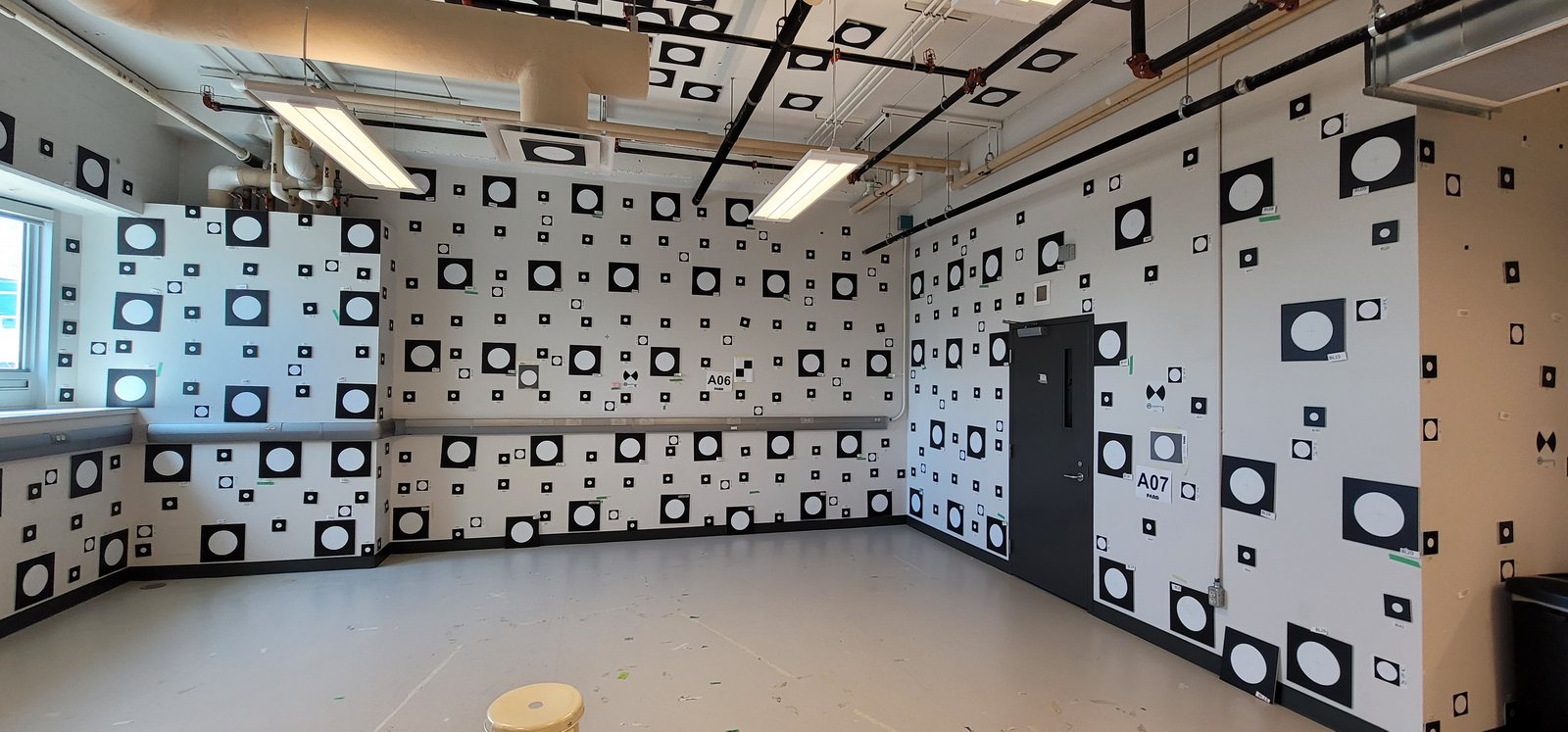 A corner of the laboratory, showing the labelled target field across two walls and the ceiling.