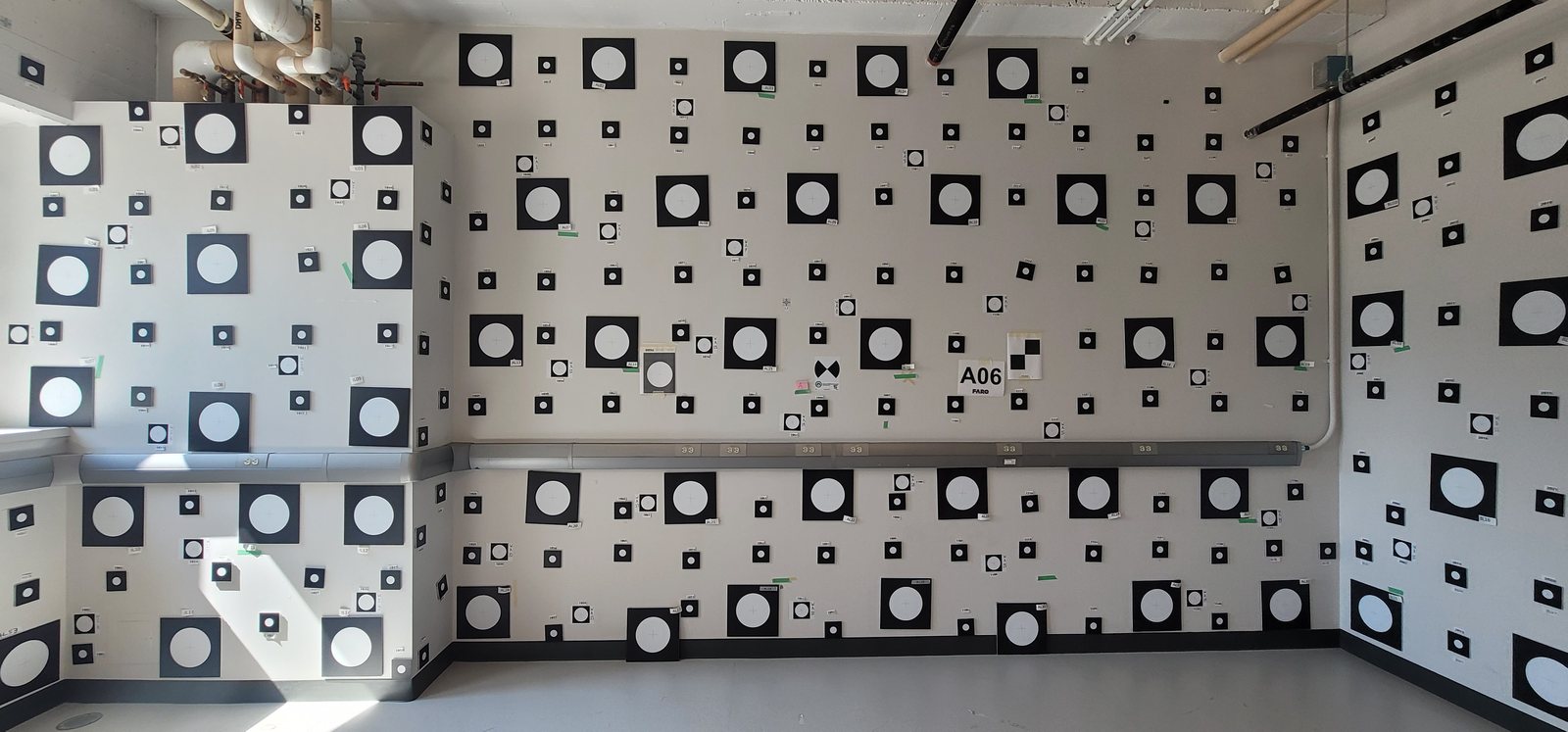 Dense signalized targets covering the laboratory walls and ceiling.